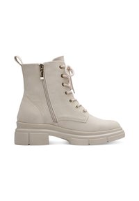Bottine beige à lacets avec fermeture éclair latérale, languette de tirage et semelle crantée épaisse.