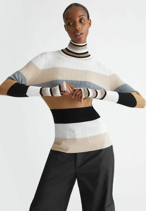 Maglione a collo alto lavorato a maglia con strisce orizzontali in beige, bianco, grigio, nero e dettagli; design a coste testurizzate. Silhouette aderente.