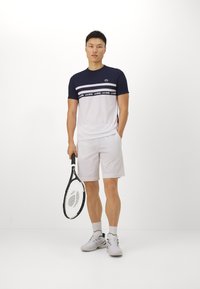 Lacoste Sport T-SHIRT TC - Sport T-shirt - white/navy blue