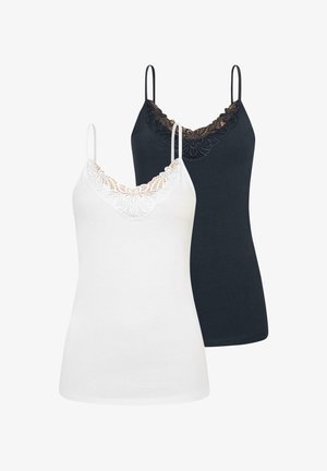 Two cami tops in white and black. Both feature adjustable straps and a lace trim along the V-neckline. Soft cotton material.