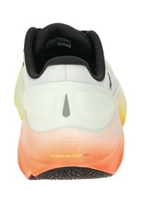 Rear view of running shoes featuring a white mesh upper, black collar, gradient midsole from orange to green, and textured black outsole.