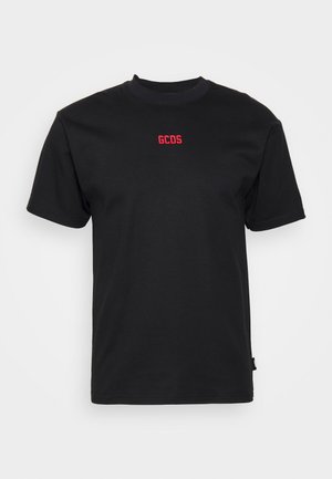 Black cotton t-shirt featuring a crew neck, short sleeves, and red "GCDS" logo on the chest; smooth texture with no visible patterns.