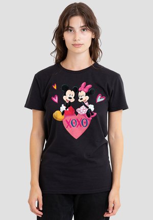 Black cotton t-shirt featuring a color graphic of Mickey and Minnie Mouse on a heart, with "XOXO" text and pink accents.