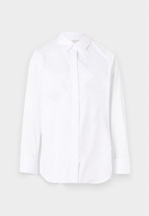 White long-sleeve shirt with a pointed collar, featuring small dotted patterns throughout, and traditional button closure. Cotton blend fabric.