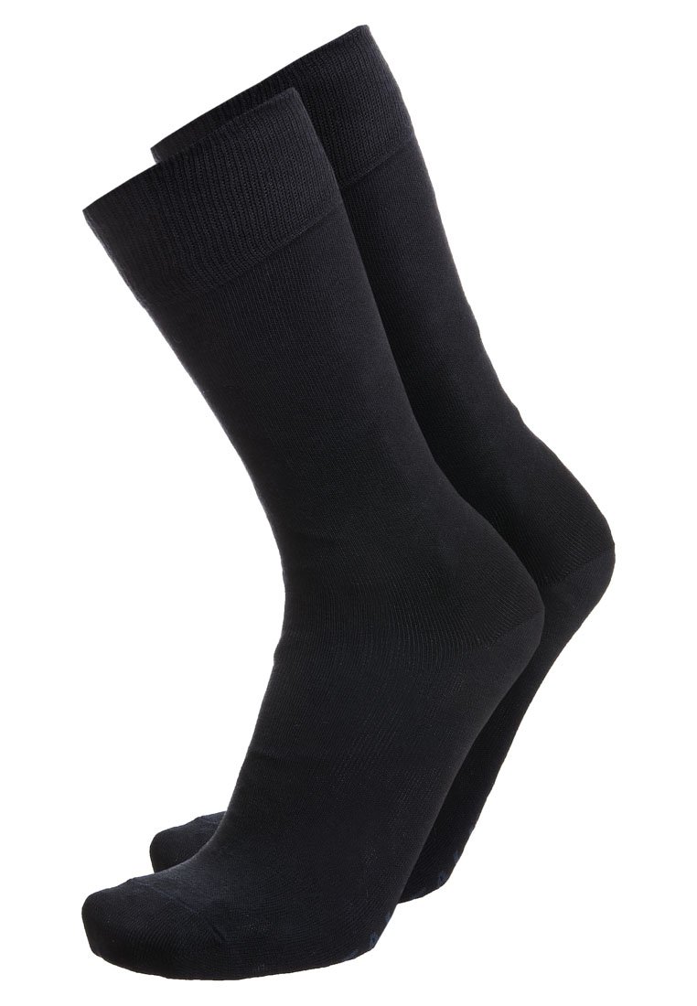 Calzini di cotone neri con polsini a costine, texture liscia e lunghezza alla caviglia. Progettati per l'uso quotidiano, presentano un colore solido classico.