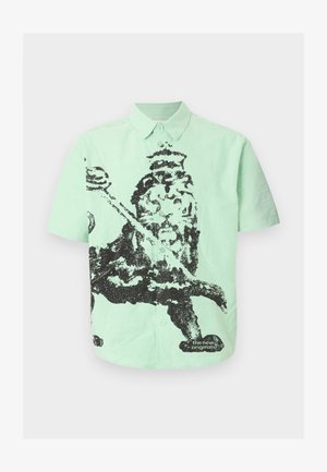 Košulja kratkih rukava u boji mente s dugmićima, s crnim pikseliziranim prikazom kralja koji drži mačetu i tekstom "the new originals" blizu ruba.