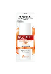 Fluide clinique anti-UV Revitafift SPF 50+, se présentant dans un flacon cylindrique blanc, avec des accents orange, et une boîte comportant du texte en français.