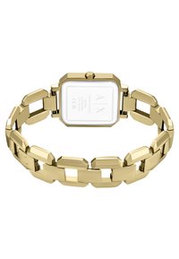 Orologio in acciaio inossidabile dorato con un quadrante rettangolare e un design a bracciale con maglie spesse. La parte posteriore presenta una superficie bianca con la scritta del marchio.