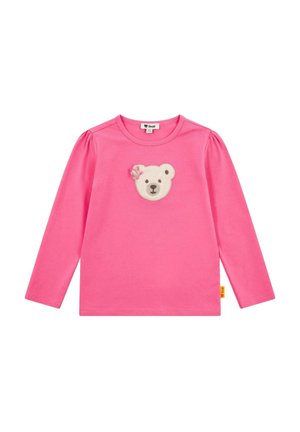 Pink long-sleeve t-shirt with puffed shoulders featuring an appliqué bear face and flower detail on the chest. Soft cotton material.