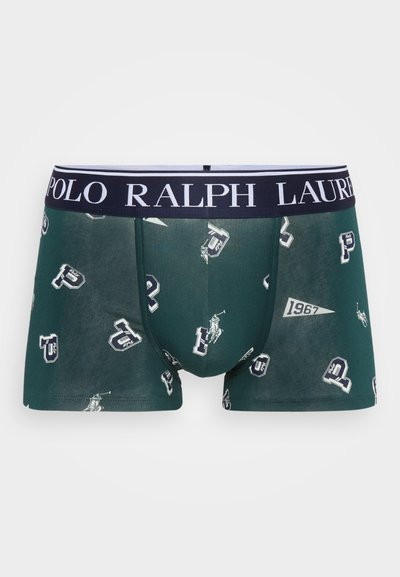 Tumšo zaļo bokseršortu ar logotipa rakstu un baltām akcentiem. Iespējas jūrā zils jostu ar tekstu "POLO RALPH LAUREN". Mīksta, teksturēta auduma.