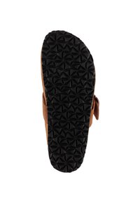 Sandalen-Sohle mit schwarzer Gummilaufsohle, die ein wiederholendes geometrisches Muster aus sich überschneidenden Bögen zeigt, und einem braunen Riemen, der an der Seite sichtbar ist.