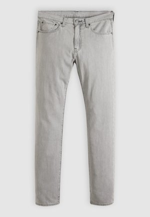 Lichtgrijze slim-fit spijkerbroek met vijf zakken, knoopsluiting en riemlussen, weergegeven tegen een effen achtergrond.