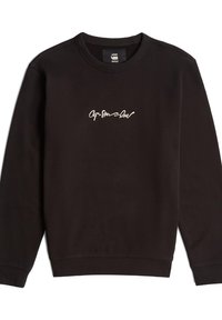Black sweatshirt made of soft fabric featuring a crew neckline and ribbed cuffs, with a white cursive logo on the front.
