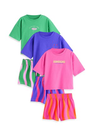 Three colorful short-sleeve t-shirt and shorts sets in green, purple, and pink with wavy striped shorts and positive text on the shirts.