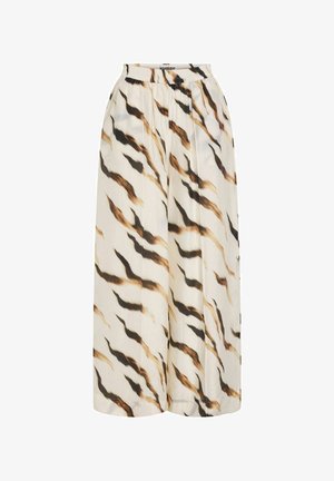 Pantalon large avec ceinture élastique, avec une base blanche et un motif de rayures abstraites ondulées noires, marron et beige.