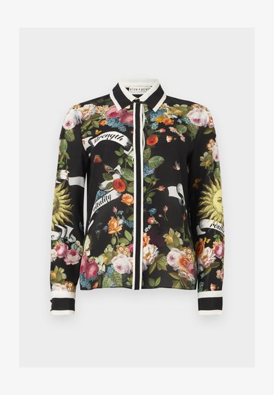 Μαύρο μπλουζάκι με μακριά μανίκια και λευκή λεπτομέρεια, με σχέδια λουλουδιών και πουλιών, εικόνες ήλιων και πανό που γράφουν "δύναμη", "ζωντάνια" και "ανθεκτικότητα".