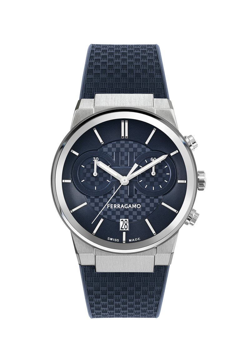 Blue chronograph watch with textured navy silicone strap, stainless steel case, patterned dial, and silver accents; features date window.