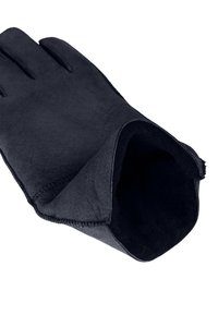 Schwarzer Lederhandschuh mit weicher, strukturierter Oberfläche, eng anliegendem Design und sichtbarer Naht entlang der Kanten. Innenfutter aus luxuriösem, weichem Material.