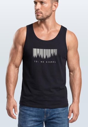 Man wearing a black tank top with a barcode design resembling trees and the text "ID: NO SIGNAL" printed on the front.