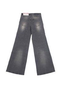 Jeans grigi larghi in denim, con design a cinque tasche, dettagli scoloriti e una patch con il logo sul retro della vita.