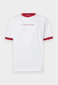 White cotton t-shirt with red ringer collar and cuffs, featuring stylized text "Lost parad" in red on the front. Short sleeves, casual fit.