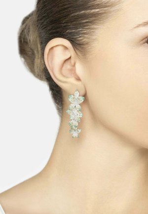 Drop earrings featuring multiple floral designs, embellished with green and clear gemstones, set in silver-tone metal, highlighting intricate details.