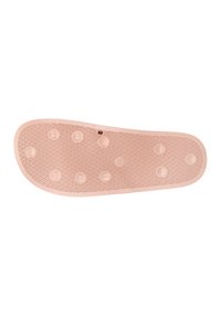 Semelle intérieure en caoutchouc rose avec une surface texturée présentant des bosses circulaires et un motif de grille géométrique. Les bords sont arrondis et lisses.