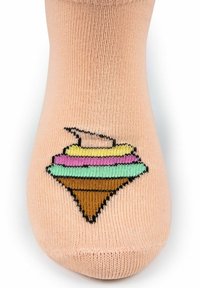 Calzino pesco con un design di giocattolo topolino colorato in giallo, rosa, verde e marrone sulla parte anteriore vicino alle punte.