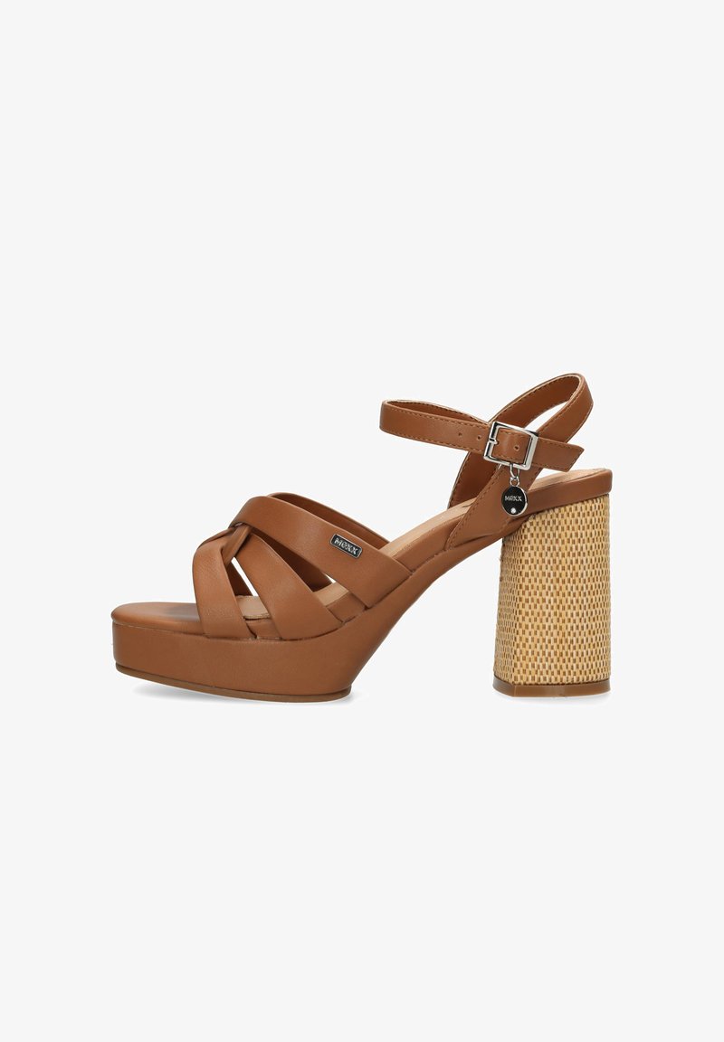 Brown platform sandals with cross straps, a chunky woven heel, and a metallic buckle accent. Smooth texture with a rounded toe design.