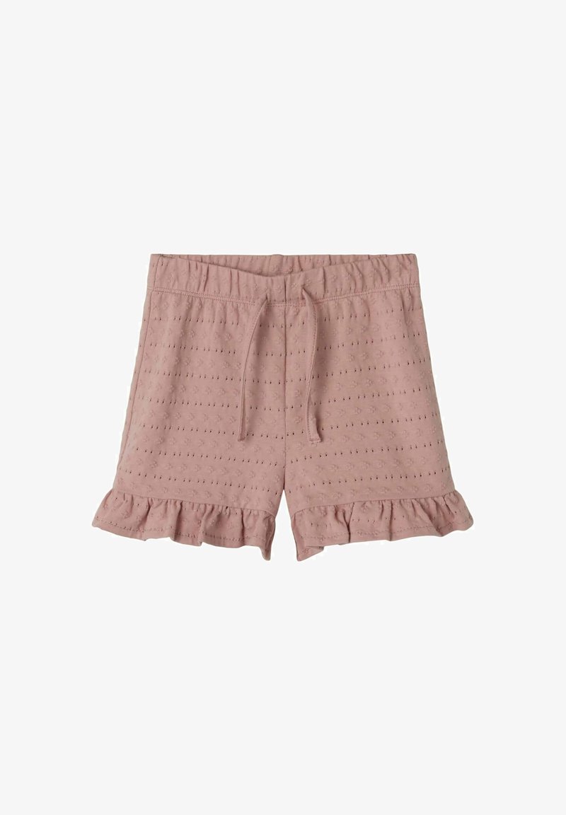 Svetloružové bavlnené šortky s elastickým pásom, šnúrkou na stiahnutie a volánovým lemom. Obsahujú jemne vyšívané očkato vzory po celom povrchu.
