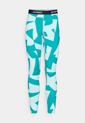 Turquoise leggings with abstract white and teal geometric patterns. Made of stretchy material, featuring a black TERREX logo waistband.