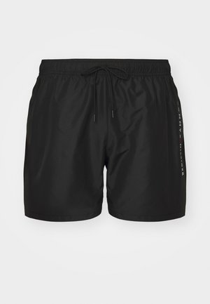 Black swim shorts made from lightweight fabric, featuring an elastic waistband with a drawstring and a vertical logo accent on the side.
