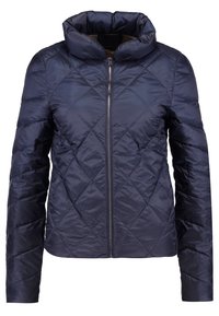 Veste matelassée bleu marine avec col montant, fermeture éclair à l'avant, manches longues et motif de piqûres en losange.