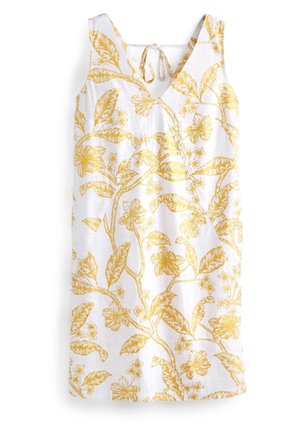 Robe blanche sans manches avec motif floral et feuillage jaune, encolure en V et fermeture à nouer au dos.
