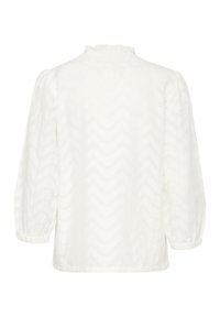 Blouse blanche avec un motif zigzag texturé, encolure smockée et manches longues à volants froncées. Coupe décontractée et tissu doux.