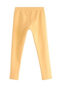 Bløde gule leggings med elastisk talje, designet til en tætsiddende pasform, vist fladt på en hvid baggrund.