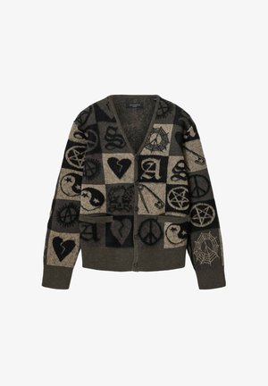 Buttoned cardigan with patchwork design featuring hearts, peace signs, safety pins, spider webs, yin-yangs, and abstract symbols in dark tones.