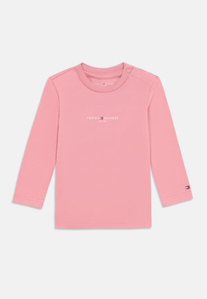 Rózsaszín, hosszú ujjú, pamut ing, kerek nyakkivágással, vállon patentgombbal, és fehér "TOMMY HILFIGER" logónyomattal elöl.