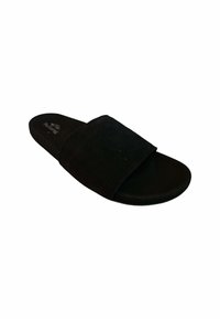 Sandalia deslizante de ante negro con una amplia correa superior y suela plana. Textura suave con un diseño minimalista y sin herrajes visibles.