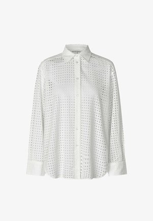Bela bombažna srajca z ovratnikom na gumbe, ki ima odprto zasnovo majhnih kvadratov, dolge rokave in ohlapen kroj.
