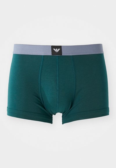 Mørk teal herreboxershorts med grå midjebånd. Har en frontlomme og flate sømmer for komfort. Merke med logo vises på midjebåndet.