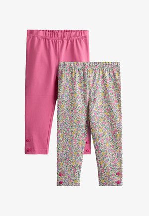 Două perechi de colanți pentru copii mici: unul roz uni, celălalt cu model floral multicolor, ambele cu talie elastică și detalii cu nasturi lângă glezne.