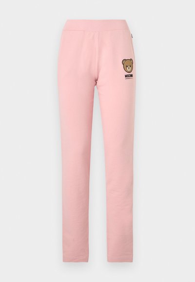 Ανοιχτό ροζ εφαρμοστά παντελόνια με ελαστική μέση, μικρό λογότυπο αρκουδάκι και το κείμενο «Moschino Underwear» στο αριστερό ισχίο.