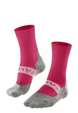 Rosa Socken mit grauen Akzenten. Gerippte Textur, gepolsterte Sohle, gestreiftes Band in der Mitte mit Logo. Knöchelhöhe, geeignet für Sport.