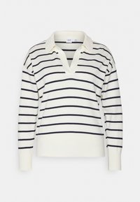 Weißer Strickpullover mit tiefem V-Ausschnitt, ausgestattet mit dunkelblauen horizontalen Streifen. Lange Ärmel mit gerippten Bündchen. Lässiger, lockerer Schnitt.
