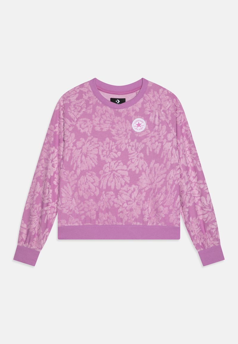 Pull en lavande à manches longues avec un motif floral et des bords côtelés aux poignets, à l'ourlet et au col, arborant un petit logo rond Converse All Star sur la poitrine.