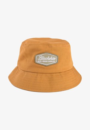 Orange bucket hat made of cotton with a wide brim. Features a patch reading "Blackskies" on a rectangular background. Stitching visible.