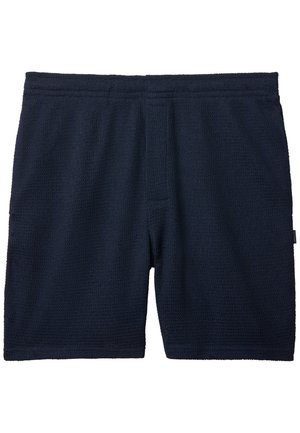 Σορτς από υφασμάτινο υλικό σε ναυτικό μπλε χρώμα, με ελαστική μέση, μήκος μέχρι το μέσο του μηρού και διακριτική ετικέτα στο δεξί πόδι.