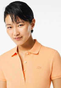 Lacoste Piké - orange clair ixy