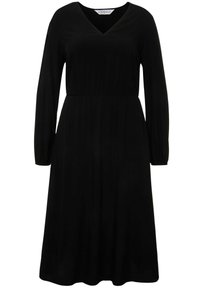 Vestido negro de manga larga con escote en V, cintura ajustada y silueta fluida, hecho de una tela ligera. Textura suave sin patrones.